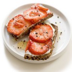 5-healthy-snacks-for-100-calories-or-less-strawberry-sandwhich-ss ezekiel bread topped with goat cheese and strawberries - YUM!